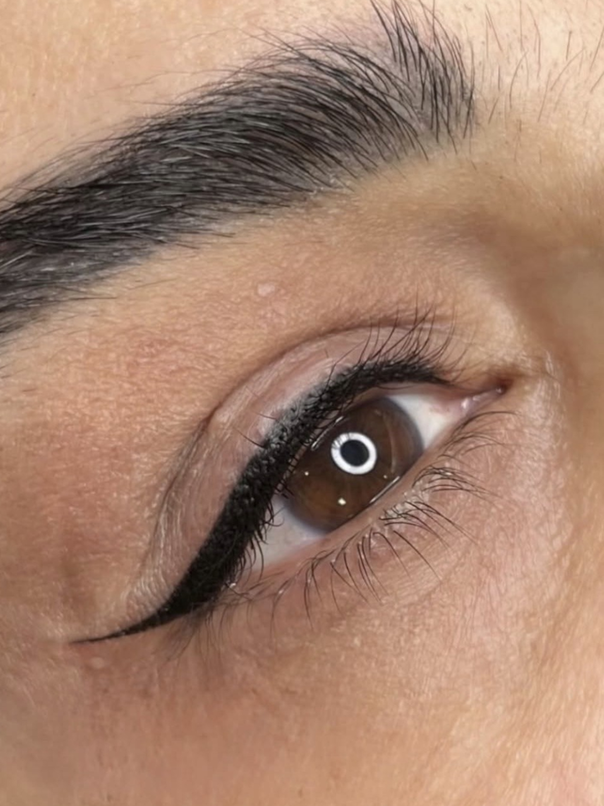 Close-up eye portrait for eyeliner tattoo treatment