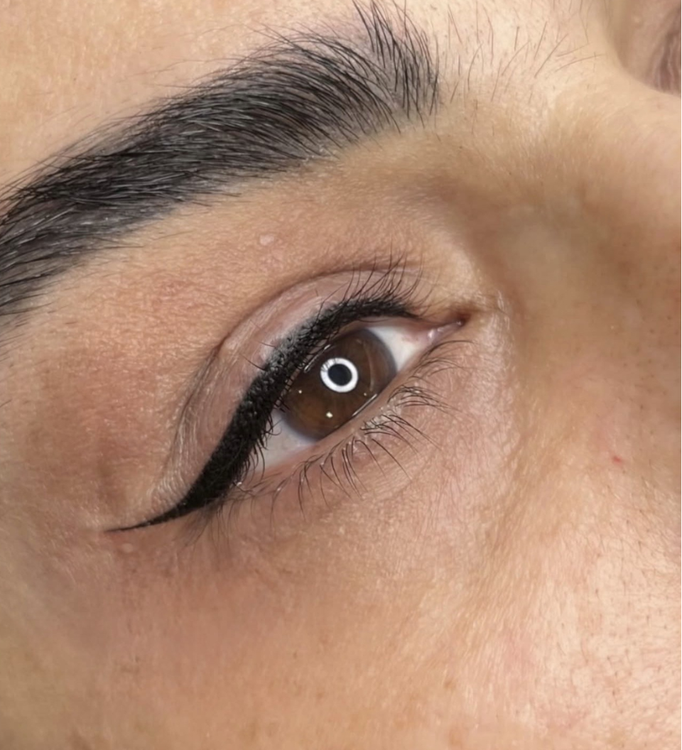 Winged eyeliner tattoo